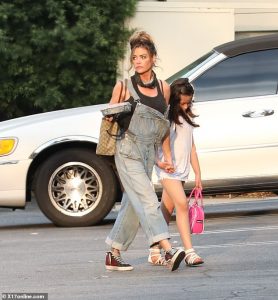 Denise Richards dons denim overalls as she heads to lunch in LA with